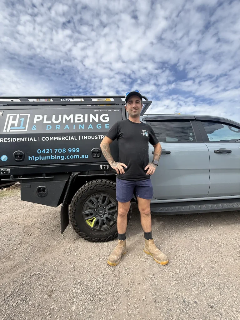 H1 Plumbing & Drainage plumber with the work van, ready for an emergency callout